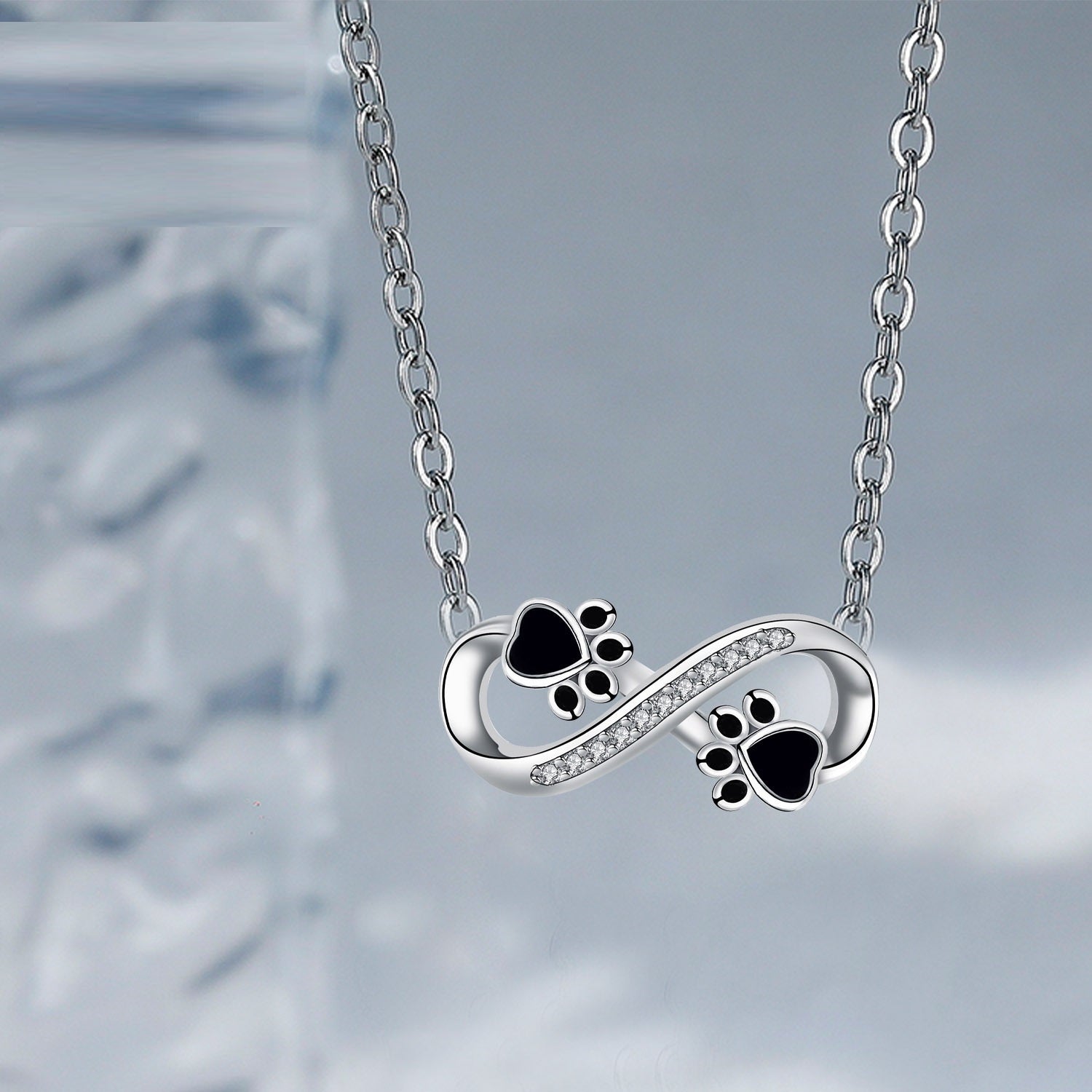 Collana Infinity con impronta di zampa e zirconi