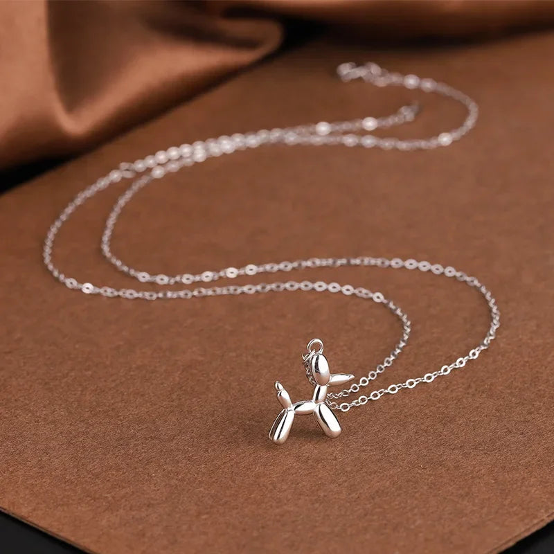 Collana con pendente a forma di cane palloncino color oro