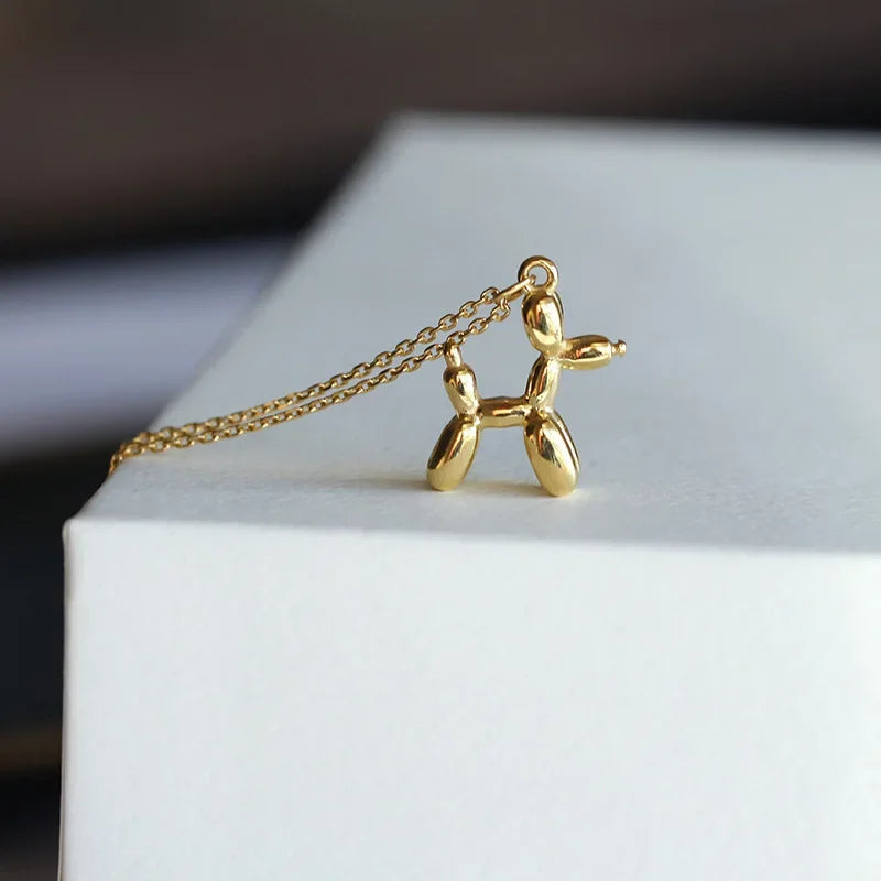Collana con pendente a forma di cane palloncino color oro