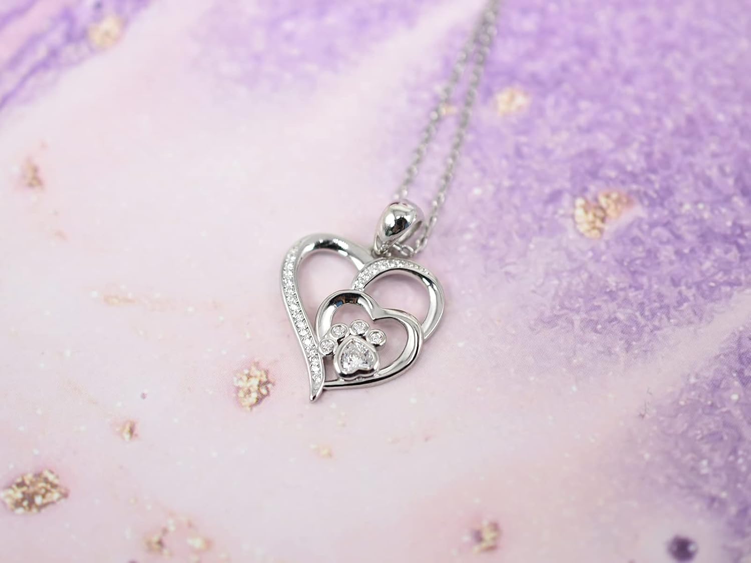 Collana in argento sterling con zampa e cuore con zirconi