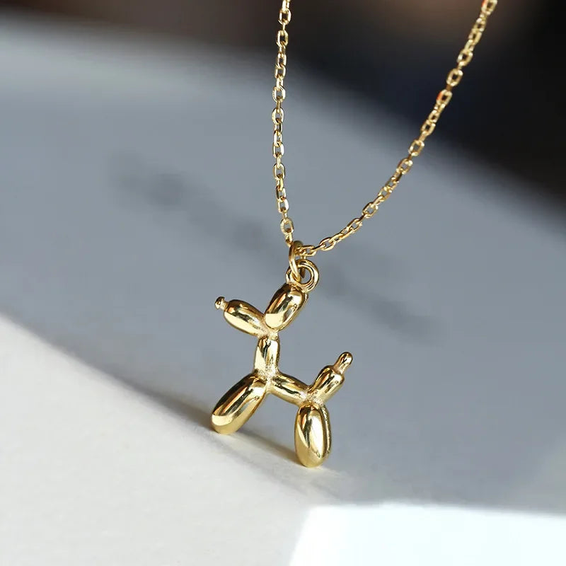 Collana con pendente a forma di cane palloncino color oro